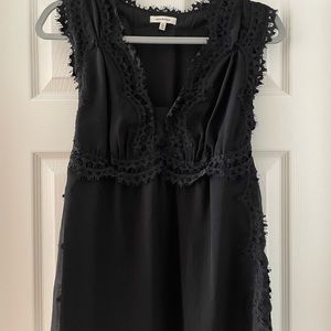 Max Studio adorable black sleeveless top sheer with lining.